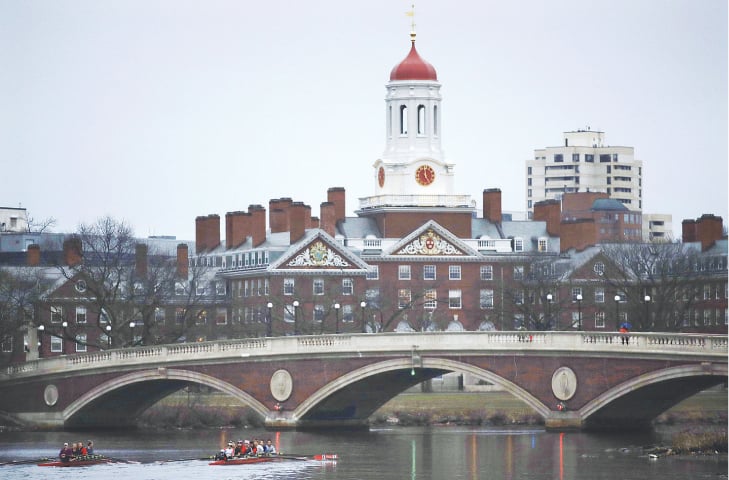 A 2017 file photo shows rowers paddling along the Charles River past the Harvard University campus in Cambridge, Massachusetts.—AP