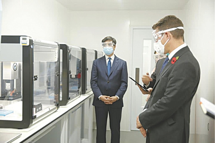 BRITISH High Commissioner Dr Christian Turner and Ambassador-at-Large for Foreign Investments Ali Jehangir Siddiqui being informed about the ‘robot-operated’ Covid-19 testing laboratory on Thursday.