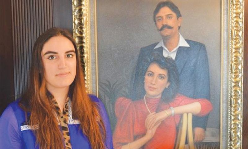 Bakhtawar Bhutto-Zardari standing next to the portrait of her parents Benazir Bhutto and Asif Ali Zardari. — File photo