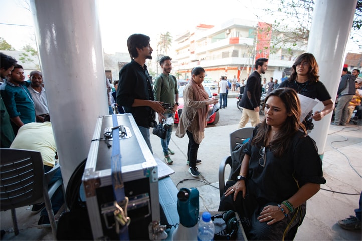 Above and below: behind the scenes of the Zee5 production Ek Jhooti Love Story where the director Mehreen Jabbar can be seen reviewing the footage just shot