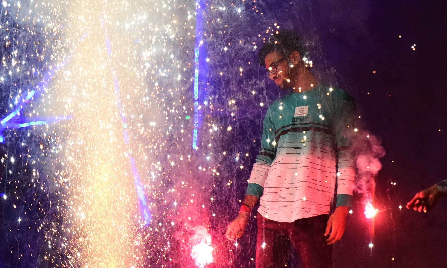 People light firecrackers during Diwali in Allahabad, India on November 14. — AFP