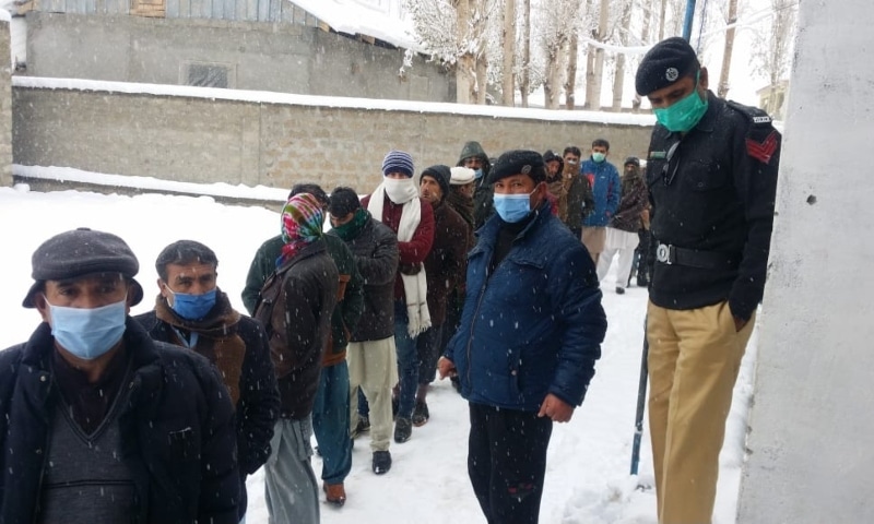 Voters line up outside a polling station in Ghizer. — Photo courtesy Umar Bacha