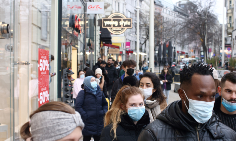 People walk past stores before the Austrian government is due to announce a lockdown including the closure of all non-essential shops, as the spread of Covid-19 continues, in Vienna, Austria on November 14, 2020. &mdash; Reuters