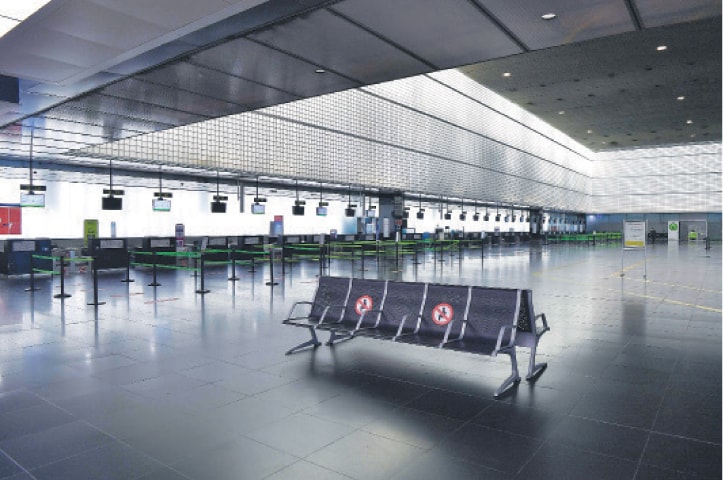 BARCELONA (Spain): Check-in counters are empty at a terminal of Barcelona’s El Prat airport as authorities prepare to transfer all activity to one terminal with the decline in air traffic amid the pandemic.—AFP