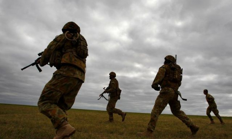 Members of Australia's special forces conduct an exercise during the Australian International Airshow in Melbourne on March 2, 2011. — Reuters