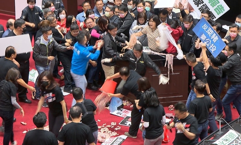 In this image made from video, lawmakers fight during a parliament session in Taipei on Nov 27. — AP