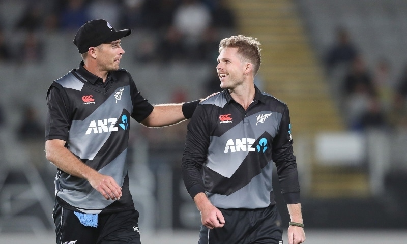 New Zealand’s Lockie Ferguson (R) celebrates a five wicket haul with captain Tim Southee during the Twenty20 international cricket match between New Zealand and the West Indies on Nov 27. — AFP