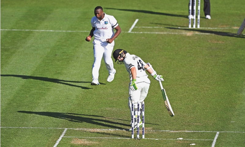HAMILTON: West Indies fast bowler Kemar Roach celebrates after dismissing New Zealand opener Tom Latham for 86 during first Test at Seddon Park on Thursday.&mdash;AP