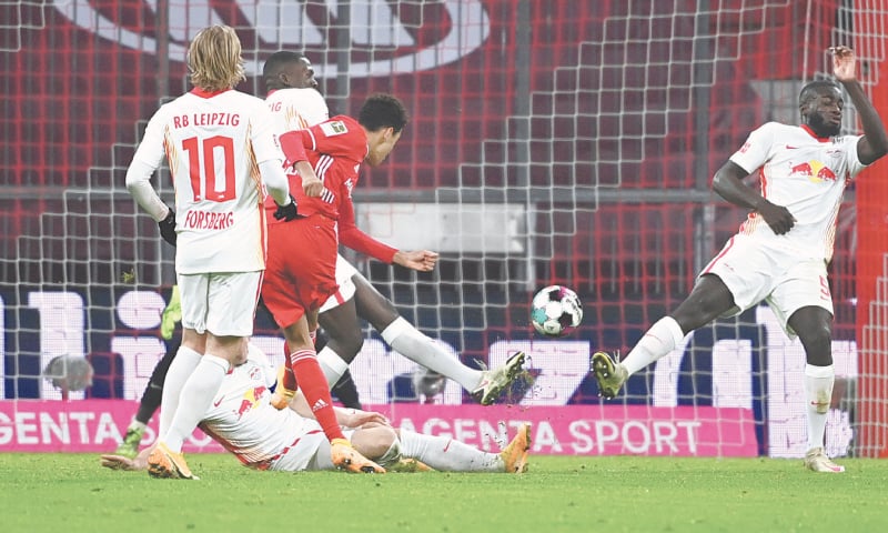 MUNICH: Bayern Munich&rsquo;s Jamal Musiala (C) scores against RB Leipzig during their Bundesliga match at the Allianz Arena.&mdash;AP