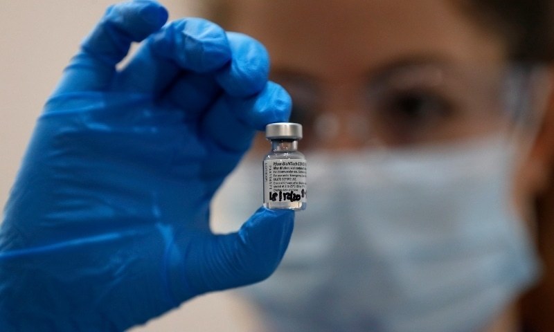 A nurse holds a phial of the Pfizer-BioNTech  Covid-19 vaccine at Guy's Hospital in London on Dec 8. — AP/File