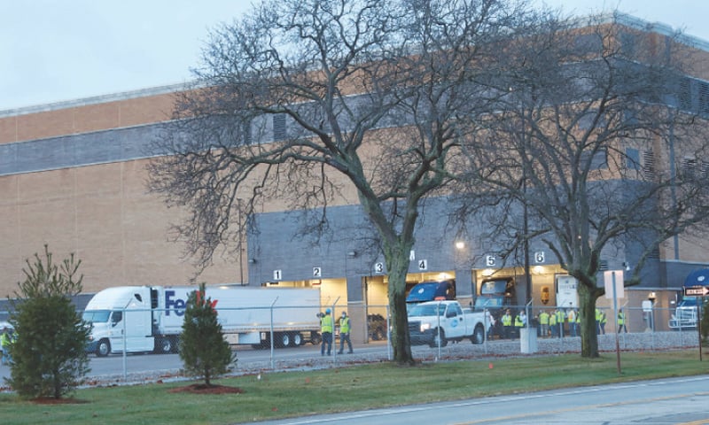 Portage (Michigan, US): A FedEx truck is being readied to carry packs of the vaccine from a Pfizer manufacturing plant with a small convoy. &mdash; Reuters