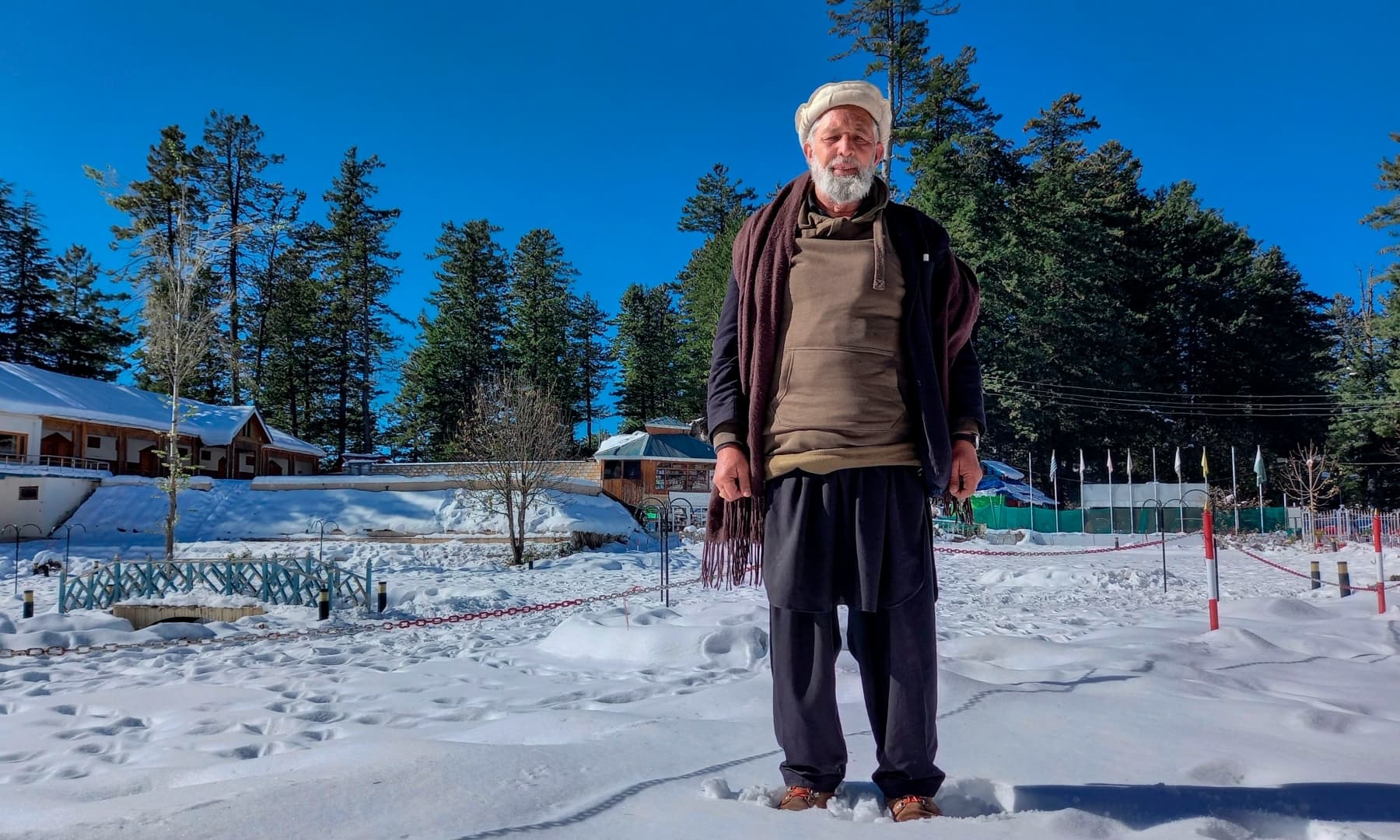 In this picture taken on November 21, 2020, Mohammad Naseem poses for a photograph in the Shogran hill area in Kaghan Valley. — AFP