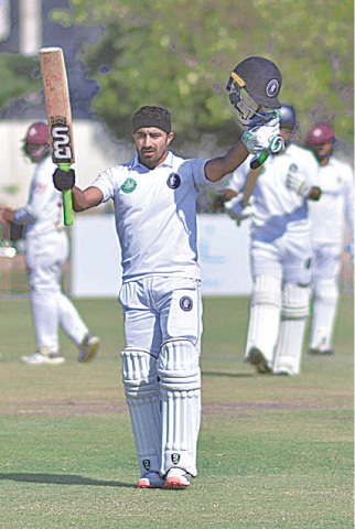 KHYBER Pakhtunkhwa’s Adil Amin celebrates after scoring century against Southern Punjab at the UBL Sports Complex. —Courtesy PCB