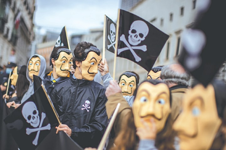 Demonstrators protest against the law to legalise euthanasia in front of the Spanish parliament.—AP