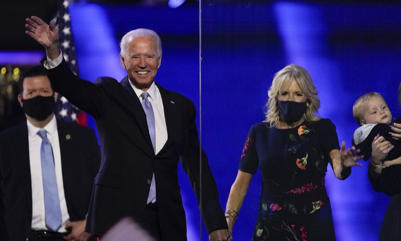 President-elect Joe Biden stands on stage with his wife Jill on Nov 7 in Wilmington, US. — AP