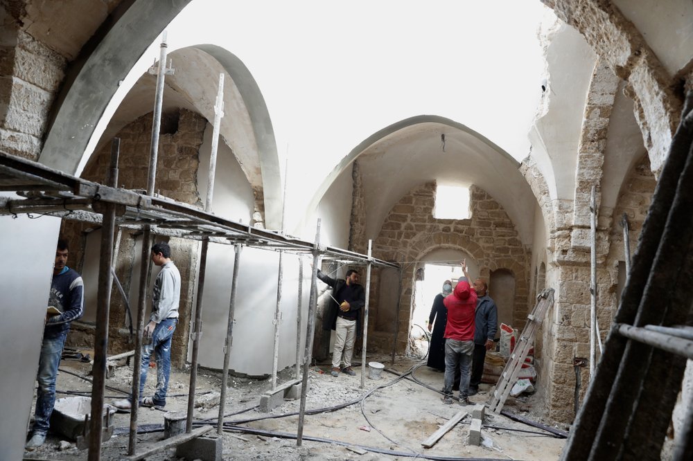 Architects and workers renovate the long-abandoned 200-year-old Ghussein palace, in the old quarter of Gaza City.