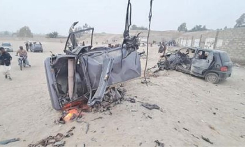 PEOPLE witness the destruction after the bomb blast in Panjgur on Saturday. &mdash; Dawn