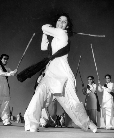 Zeenat Rashid, the then captain of the Sind Women’s National Guard, practising how to use a lathi in Karachi on November 1, 1947. — Courtesy Seafield Archive