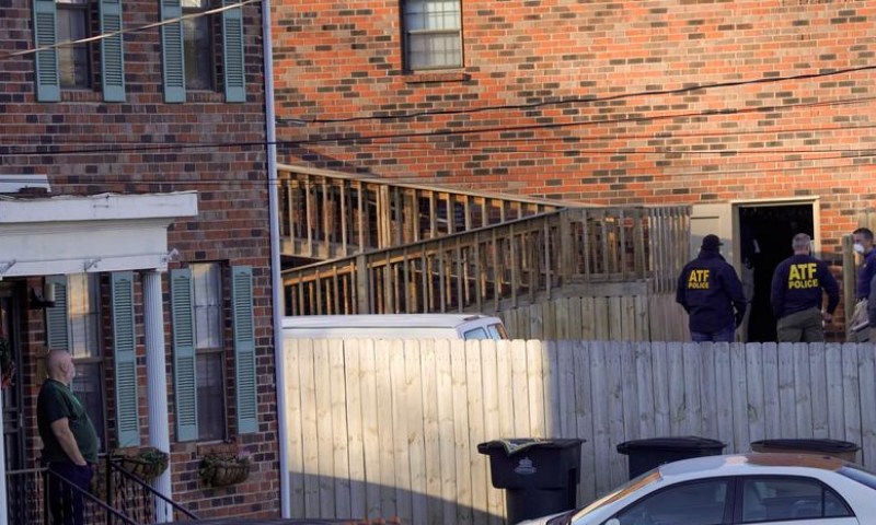Law enforcement officers gather to investigate information arising the day after a downtown Nashville explosion, outside a duplex house in Antioch, Tennessee, United States on Dec 26. &mdash; Reuters
