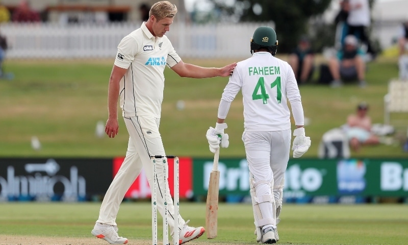 New Zealand’s Kyle Jamieson (L) gestures as Pakistan batsman Faheem Ashraf walks back to bat on day three of the first Test. — AFP