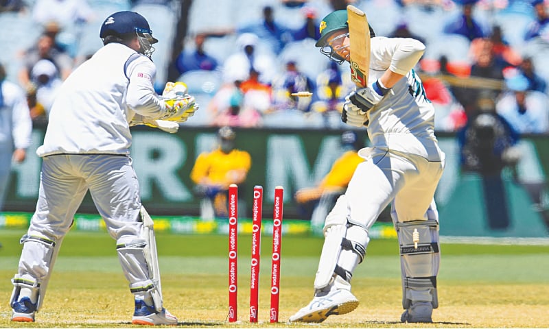 AUSTRALIA’S Josh Hazlewood is bowled by Indian spinner Ravichandran Ashwin as wicket-keeper Rishabh Pant looks on during the second Test at the MCG on Tuesday.—AFP AUSTRALIA’S Josh Hazlewood is bowled by Indian spinner Ravichandran Ashwin as wicket-keeper Rishabh Pant looks on during the second Test at the MCG on Tuesday.—AFP
