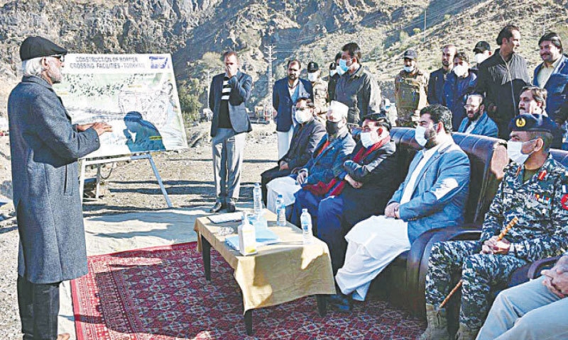 TORKHAM: Interior Minister Sheikh Rashid Ahmed being briefed about a border terminal by officials of the National Logistics Cell on Friday.—APP TORKHAM: Interior Minister Sheikh Rashid Ahmed being briefed about a border terminal by officials of the National Logistics Cell on Friday.—APP