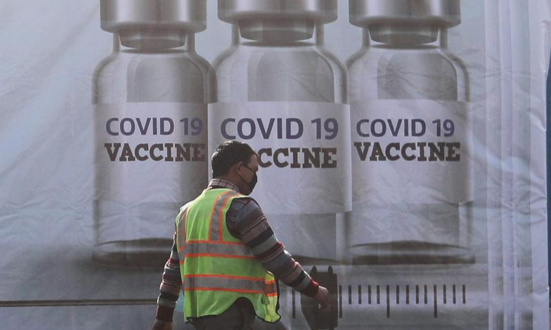 A ground staff walks past a container kept at the Cargo Terminal 2 of the Indira Gandhi International Airport, which according to the officials will be used as a Covid-19 vaccine handling and distribution center, during the media preview in New Delhi, India on Dec 22. — Reuters/File