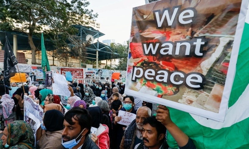 People carry placards demanding justice, following the killings of coal miners from Pakistan's minority Shi'ite Hazara community in an attack in Mach area of Bolan district, during a protest in Karachi on Jan 5. — Reuters