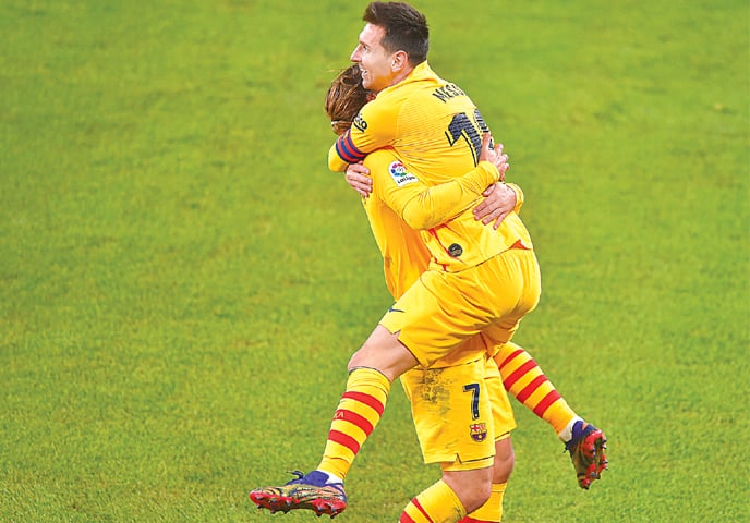 LIONEL Messi (R) celebrates with his Barcelona team-mate Antoine Griezmann after scoring against Atheltic Bilbao at the San Mames Stadium.&mdash;AFP
