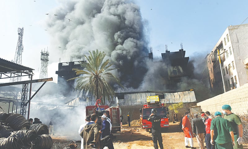 Rescuers and onlookers at the scene of the incident on Saturday.—Fahim Siddiqi/White Star Rescuers and onlookers at the scene of the incident on Saturday.—Fahim Siddiqi/White Star