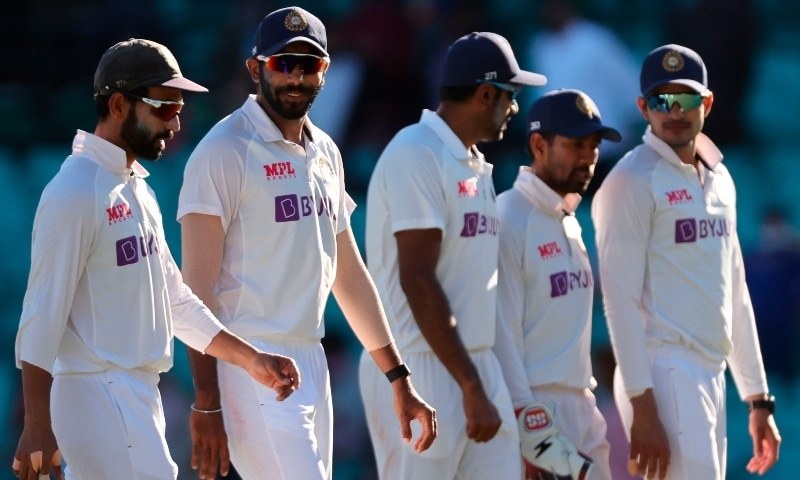 India's captain Ajinkya Rahane (L) walks along with his teammates at the end of the third day of the third cricket Test match between Australia and India at the Sydney Cricket Ground (SCG) in Sydney on January 9. &mdash; AFP/File