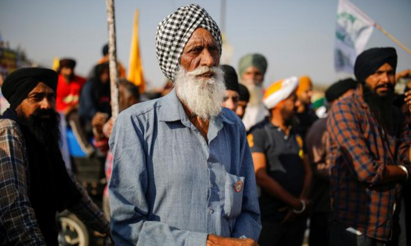 In this file photo, farmers listen to a speaker during a protest against the newly passed farm bills at Singhu border near New Delhi, India on December 9. — Reuters