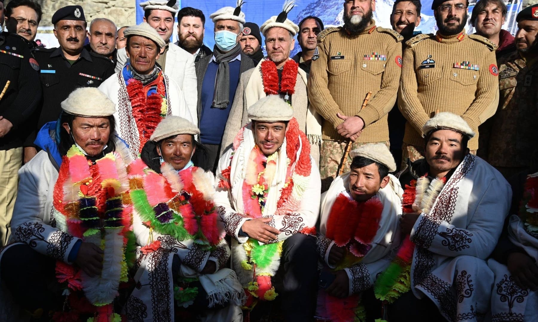 Nepal's climbers pose for a photograph with Pakistani officials while attending a welcome ceremony upon their arrival after becoming the first to summit Pakistan's K2 in winter, at Shigar district in Gilgit-Baltistan, Jan 20, 2021. &mdash; AFP