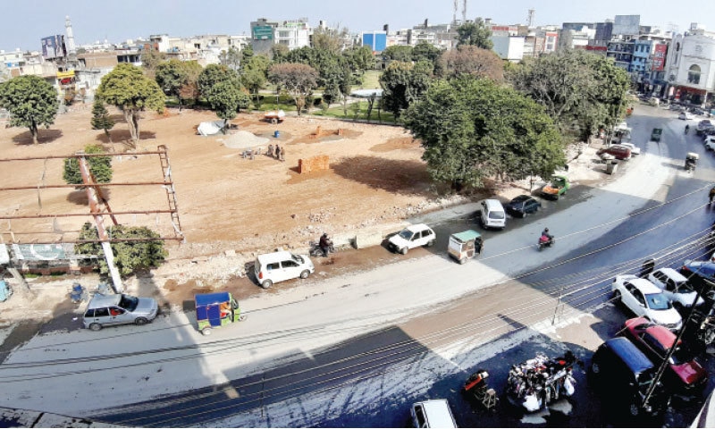 Work underway on a parking lot in Commercial Market in Rawalpindi. — White Star