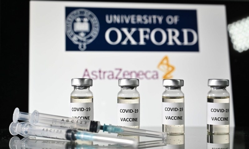 In this file photo taken on Nov 17, an illustration picture shows vials with Covid-19 vaccine stickers attached and syringes, with the logo of the University of Oxford and its partner British pharmaceutical company AstraZeneca. — AFP/File