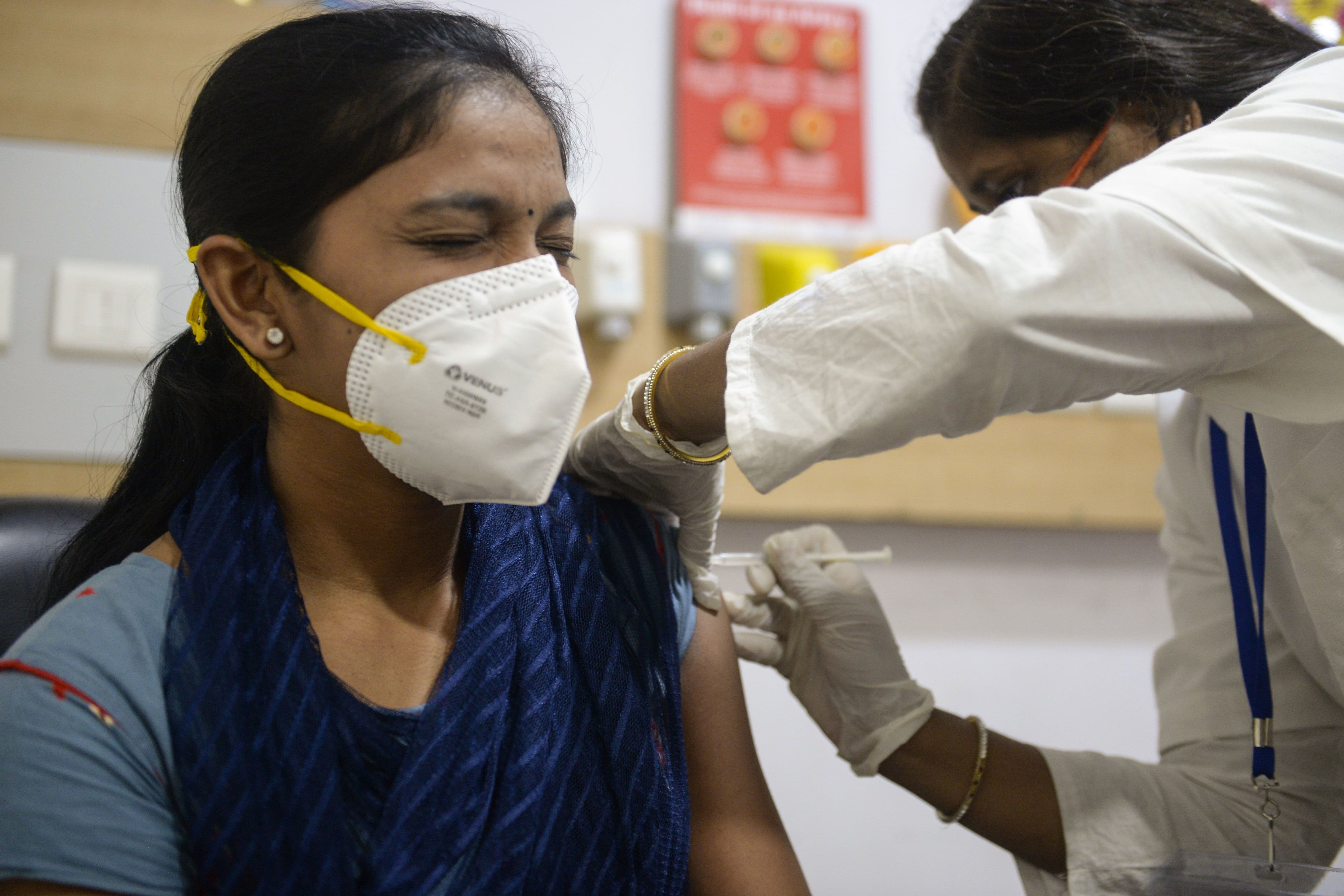 A health worker inoculates a private medical staff member with a Covid-19 coronavirus vaccine at Sunshine Hospital in Hyderabad on January 29. &mdash; AFP