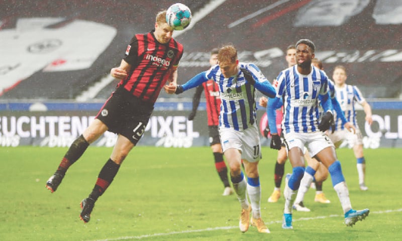 FRANKFURT: Eintracht Frankfurt’s Martin Hinteregger heads to score during the Bundesliga match against Hertha Berlin at the Deutsche Bank Park.—Reuters FRANKFURT: Eintracht Frankfurt’s Martin Hinteregger heads to score during the Bundesliga match against Hertha Berlin at the Deutsche Bank Park.—Reuters