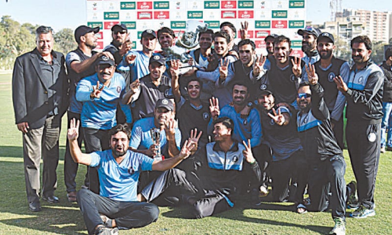 KARACHI: The victorious Khyber Pakhtunkhwa squad members celebrate with the Pakistan Cup trophy at the SBP Sports Complex 
on Sunday.&mdash;PCB