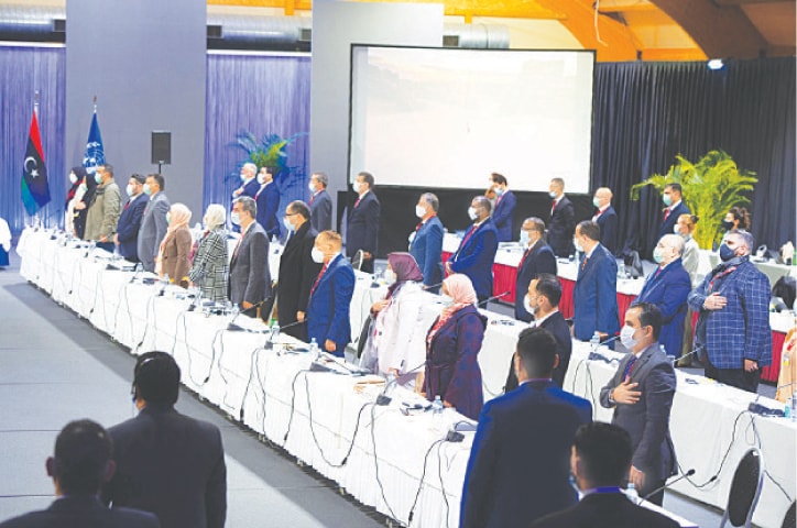 THIS handout picture released by the United Nations shows delegates standing during the playing of Libya&rsquo;s national anthem before the opening of the conference.&mdash;AFP