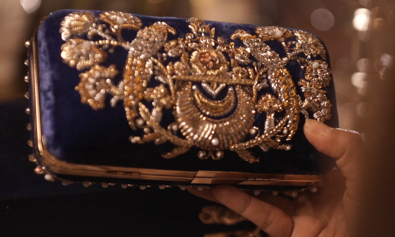 Custom-made royal blue clutch to match Benazir's sapphire necklace.