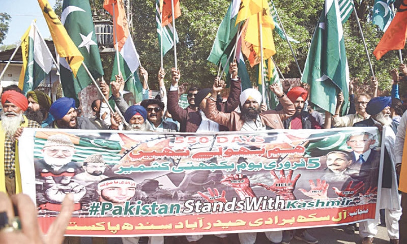MEMBERS of the Sikh community hold a rally in Hyderabad on Friday to express solidarity with Kashmiri brethren.&mdash;Dawn