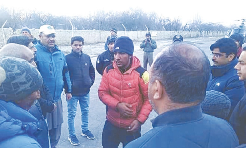 SAJID Ali Sadpara (centre), son of Muhammad Ali Sadpara, arrives at Skardu. Sajid took part in one of the missions that searched for his father and two other climbers who went missing during their K2 expedition on Friday.—Dawn