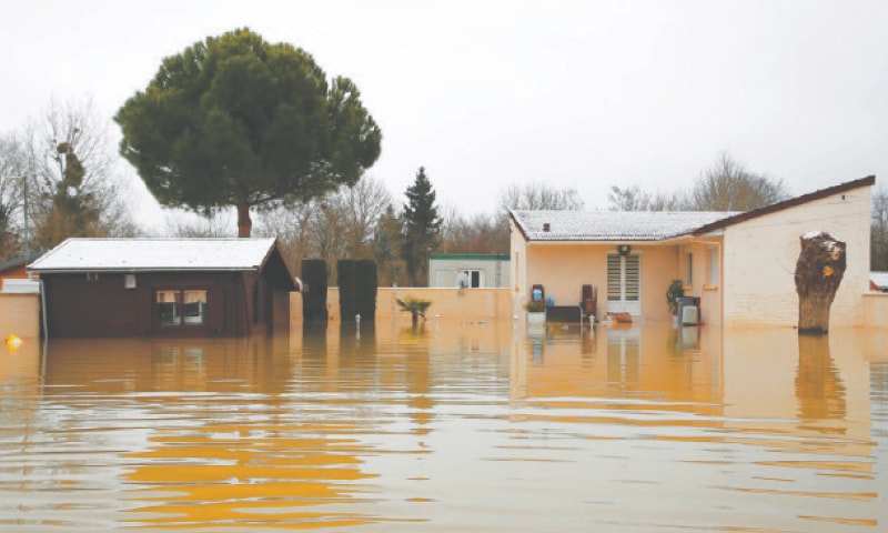 A VIEW of flooded streets by the River Marne after days of rainy weather in Esbly, near Paris.—Reuters A VIEW of flooded streets by the River Marne after days of rainy weather in Esbly, near Paris.—Reuters