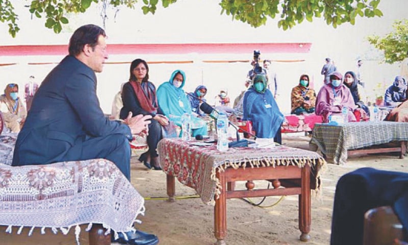 KALLAR SYEDAN: Prime Minister Imran Khan talking to beneficiaries of Ehsaas Kafalat Programme on Wednesday.—PPI