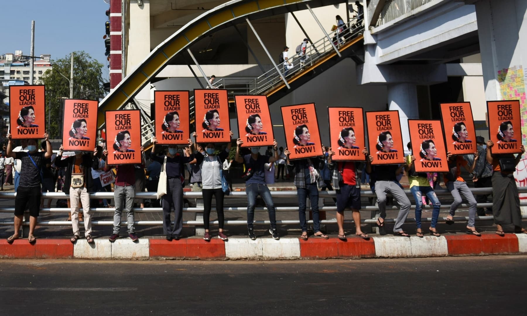 Demonstrators hold up placards depicting elected leader Aung San Suu Kyi during a protest against the military coup in Yangon, Myanmar. — Reuters