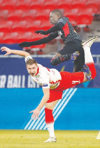 BUDAPEST: RB Leipzig&rsquo;s Willi Orban (bottom) vies for the ball with Liverpool&rsquo;s Sadio Mane during their match at the Puskas Arena.&mdash;AP
