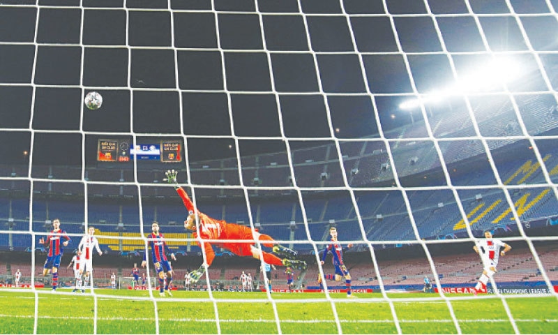 BARCELONA: Paris St Germain&rsquo;s Kylian Mbappe (R) scores his hat-trick goal during the Champions League round-of-16 first leg against Barcelona at the Camp Nou.&mdash;Reuters