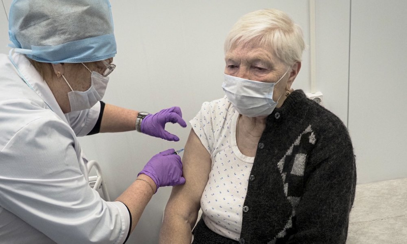A Russian medical worker administers a shot of Russia's Sputnik V coronavirus vaccine to Galina Shilova in a local rural medical post in the village of Ikhala in Russia’s Karelia region. — AP