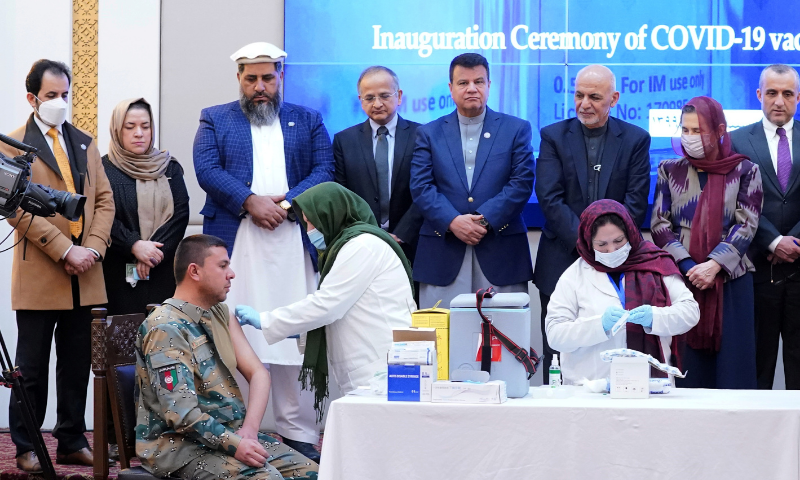 Members of Afghan security forces receive the first dose of AstraZeneca's Covid-19 vaccine from India, during a ceremony at the presidential palace in Kabul, Afghanistan on Tuesday. — Reuters