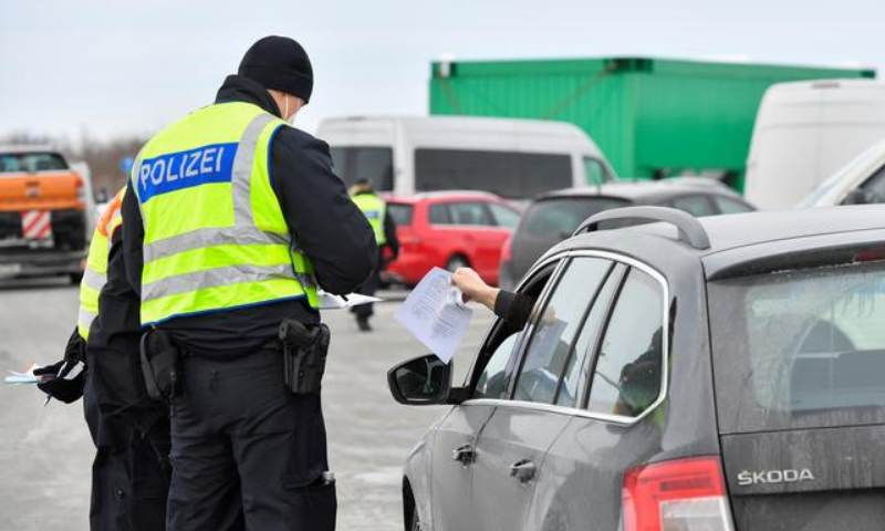 German border police officers check a car at the A17 motorway near the Czech-German border after controls between Germany and the Czech Republic have been re-established. — Reuters/File